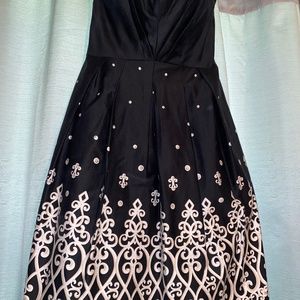 Black bodice dress with white and tan detail